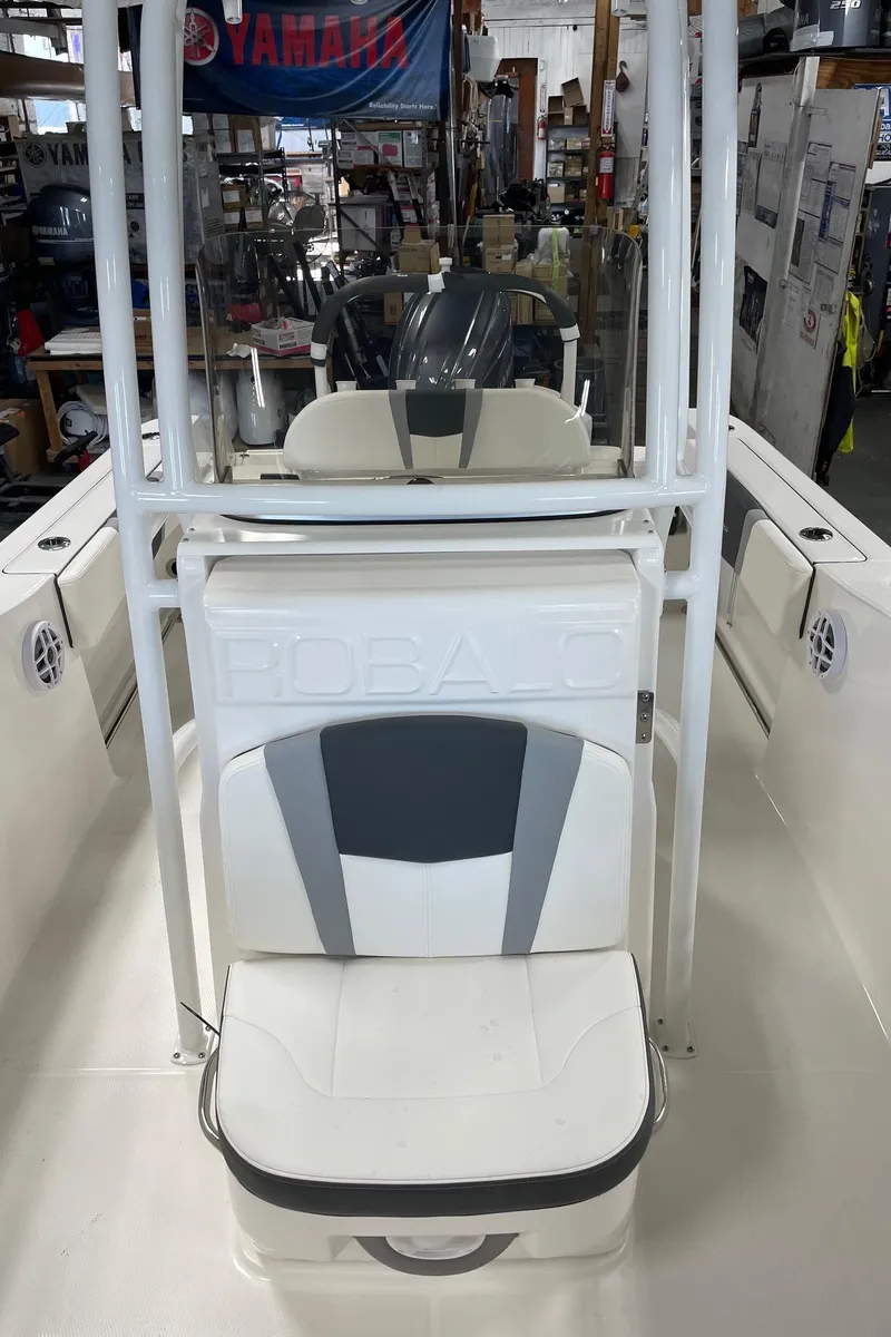 Slide: The Image of 2024 Robalo R200 Center Console boat interior with seating and storage. - 21