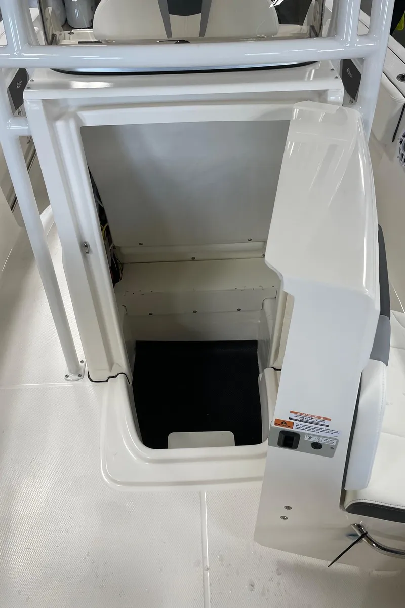 Slide: The Image of 2024 Robalo R200 Center Console storage compartment. - 22