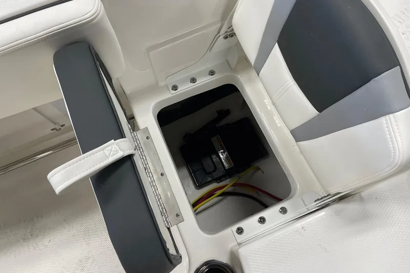 Slide: The Image of 2024 Robalo R200 Center Console boat battery compartment with seating. - 23