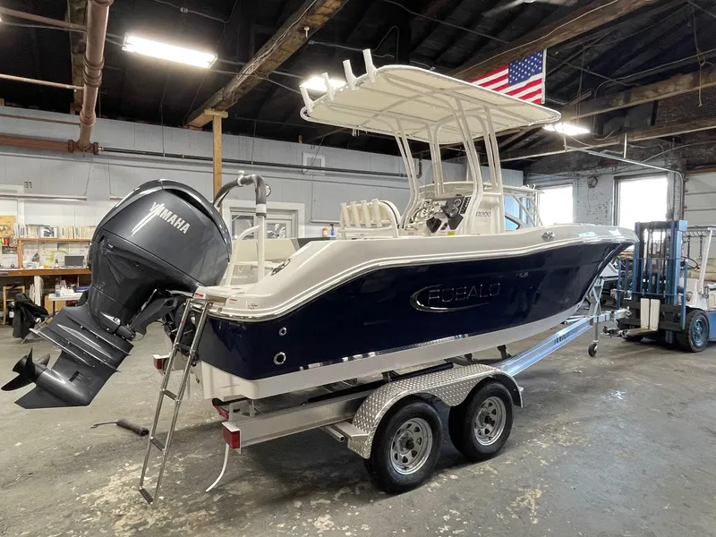 Slide: The Image of 2024 Robalo R200 Center Console boat on trailer in warehouse. - 3