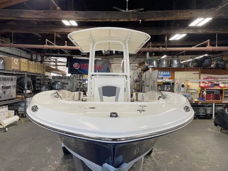 Slide: The Image of 2024 Robalo R200 Center Console boat in a workshop. - 4