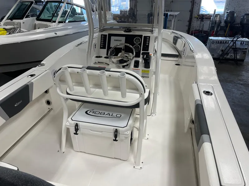 Slide: The Image of 2024 Robalo R200 Center Console boat interior with helm and seating. - 7