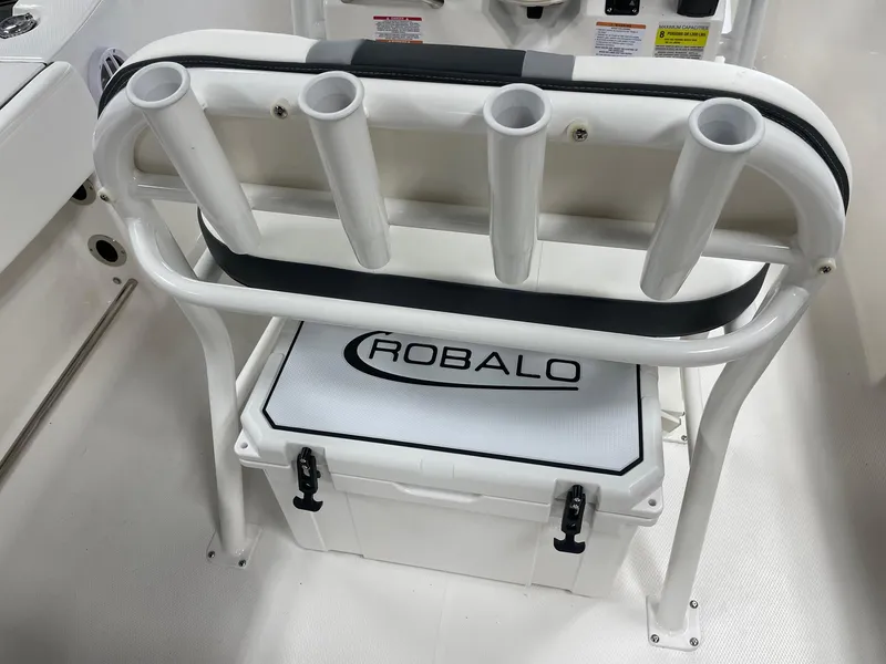 Slide: The Image of 2024 Robalo R200 Center Console boat with rod holders and cooler. - 9