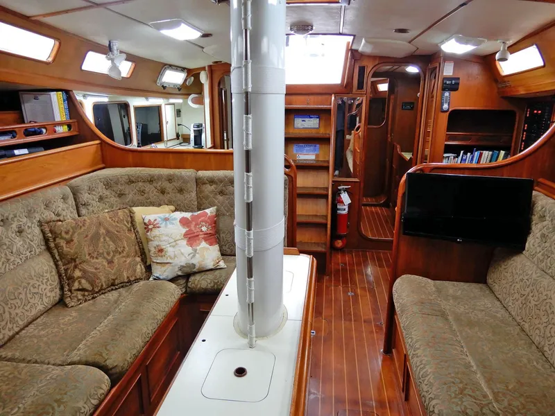 Slide: The Image of Luxurious 1985 Barnett Offshore yacht interior with plush seating and wooden finishes. - 2