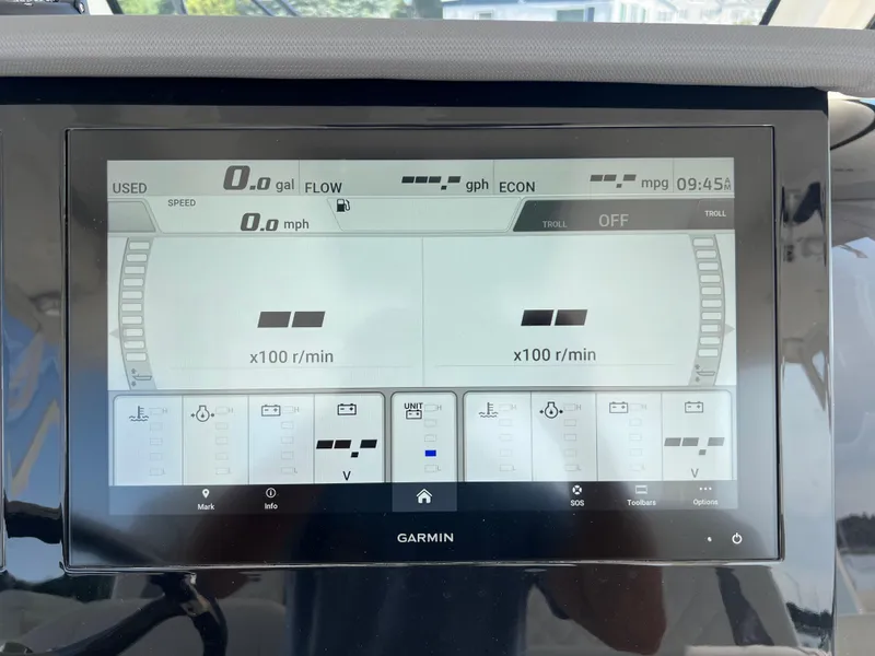 Slide: The Image of Garmin display on 2024 Pursuit S 328 Sport boat showing engine metrics and navigation data. - 17