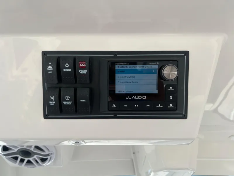 Slide: The Image of Control panel of 2024 Pursuit S 328 Sport boat with JL Audio system. - 18