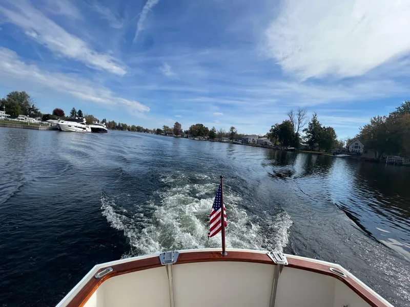 Slide: The Image of View from the stern of a 2000 Bruckmann Bluestar 29.9 boat cruising on a lake. - 11