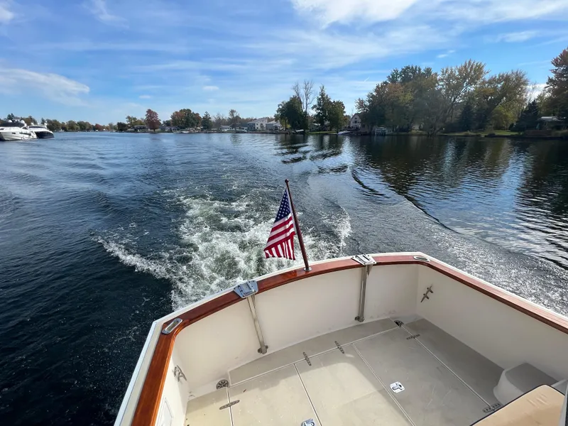 Slide: The Image of View from the stern of a 2000 Bruckmann Bluestar 29.9 boat on a calm lake. - 12