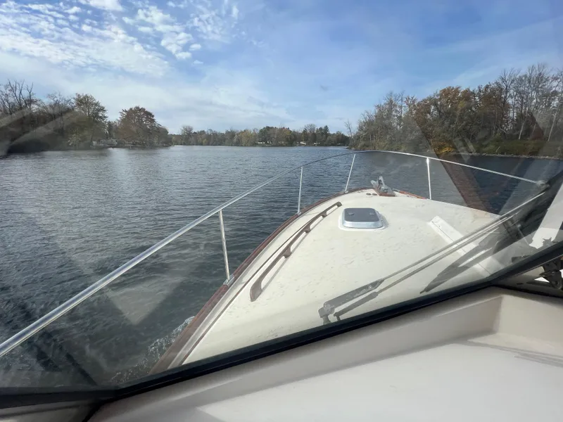 Slide: The Image of View from the helm of a 2000 Bruckmann Bluestar 29.9 cruising on a calm river. - 18