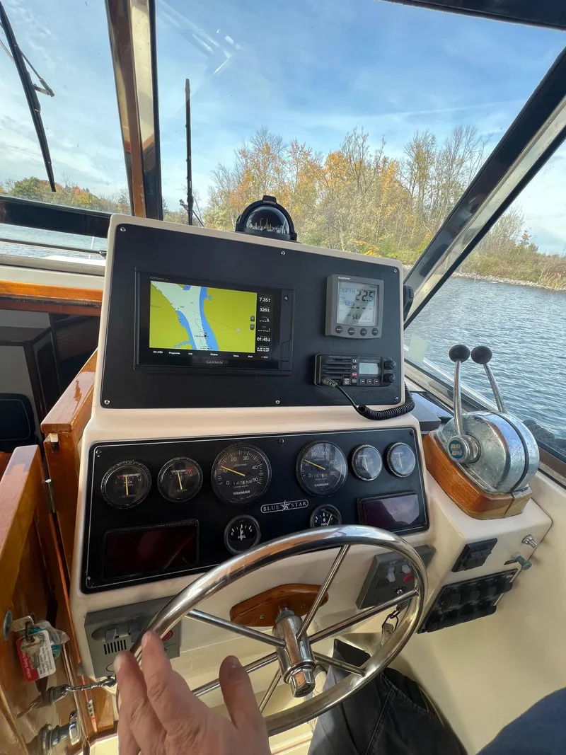 Slide: The Image of Bruckmann Bluestar 29.9 2000 boat dashboard with navigation system and controls. - 19