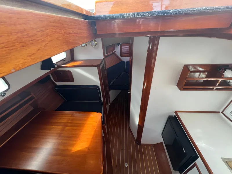 Slide: The Image of Interior of 2000 Bruckmann Bluestar 29.9 yacht with wooden finishes and modern amenities. - 24