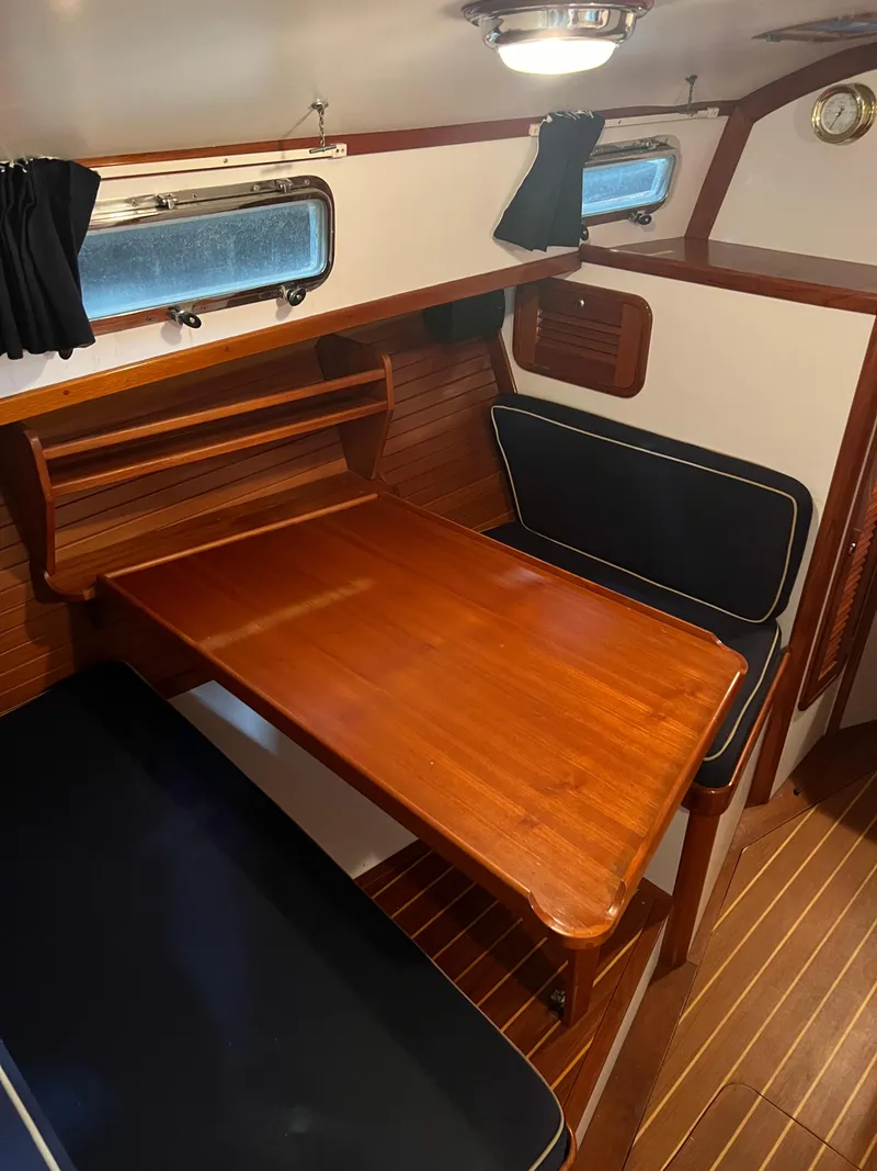 Slide: The Image of Interior of 2000 Bruckmann Bluestar 29.9 with wooden table and seating. - 28