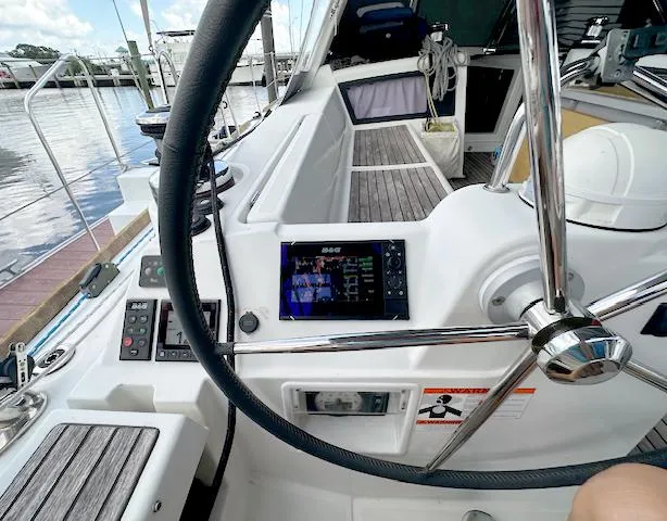 Slide: The Image of Cockpit view of 2019 Beneteau Oceanis 48 sailboat with steering wheel and navigation instruments. - 14