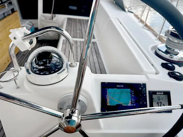 Slide: The Image of Steering wheel and navigation instruments on 2019 Beneteau Oceanis 48 yacht. - 15