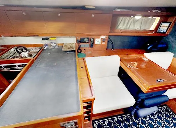 Slide: The Image of Interior of 2019 Beneteau Oceanis 48 yacht with modern kitchen and dining area. - 29
