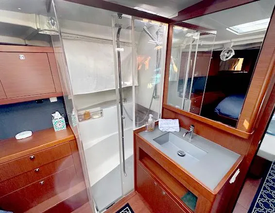Slide: The Image of Luxurious bathroom in 2019 Beneteau Oceanis 48 yacht with modern shower and sink. - 32