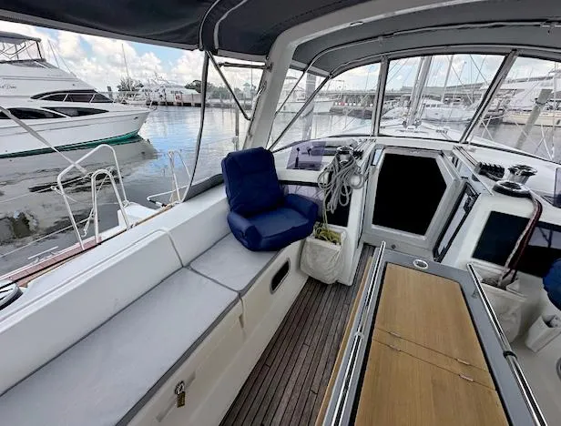 Slide: The Image of 2019 Beneteau Oceanis 48 yacht interior with seating and marina view. - 4