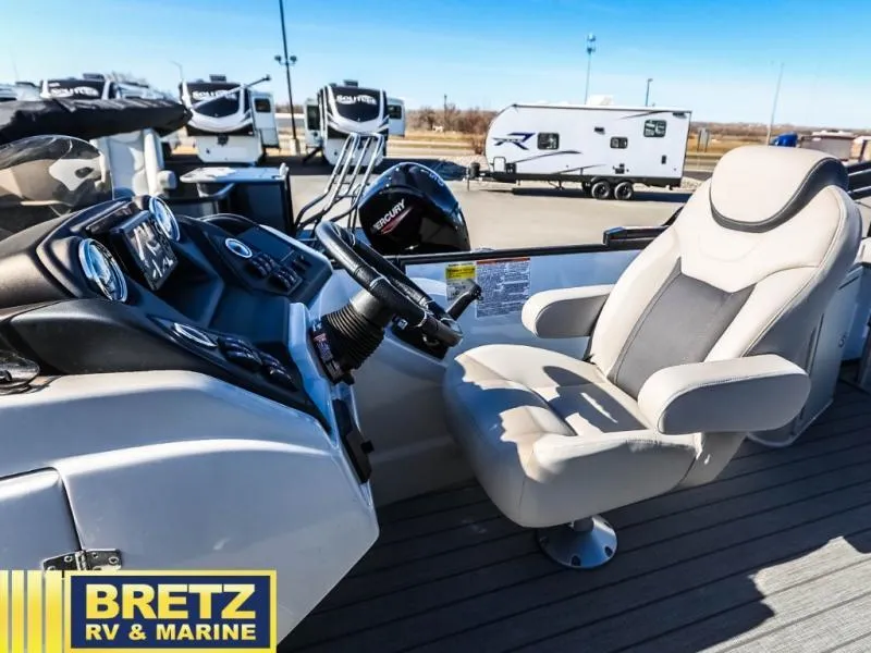 Slide: The Image of 2024 L-F DLZ BAR boat interior with captain's chair and control panel at Bretz RV & Marine. - 12