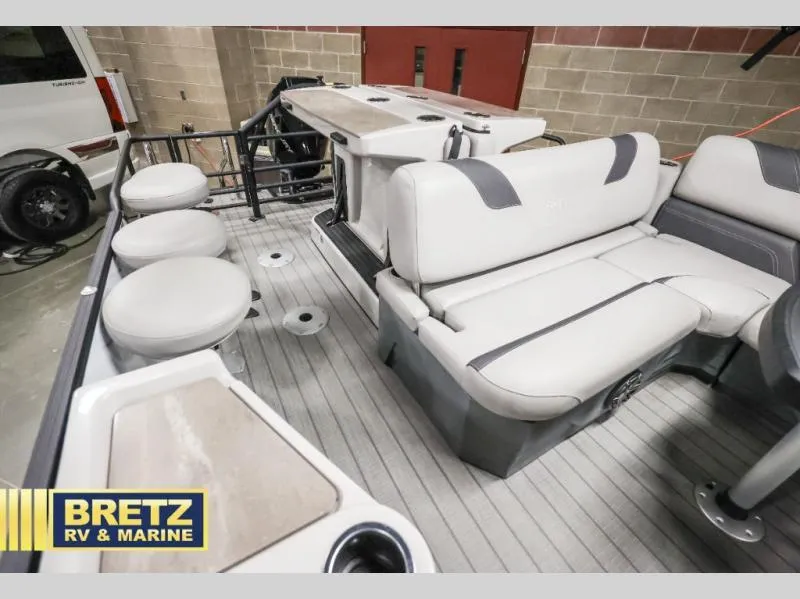 Slide: The Image of 2024 L-F DLZ BAR boat interior with seating and table, showcased at Bretz RV & Marine. - 17
