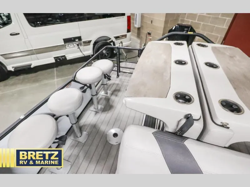 Slide: The Image of 2024 L-F DLZ BAR boat interior with seating and table, displayed at Bretz RV & Marine. - 19