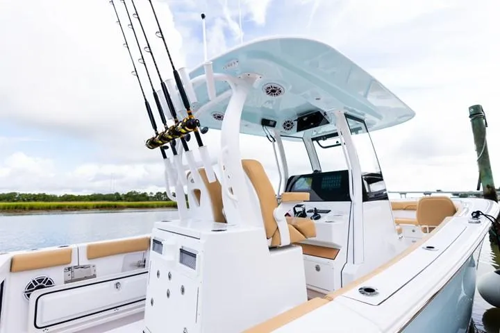 Slide: The Image of 2024 Sportsman Open 282 boat with fishing rods and modern seating. - 4