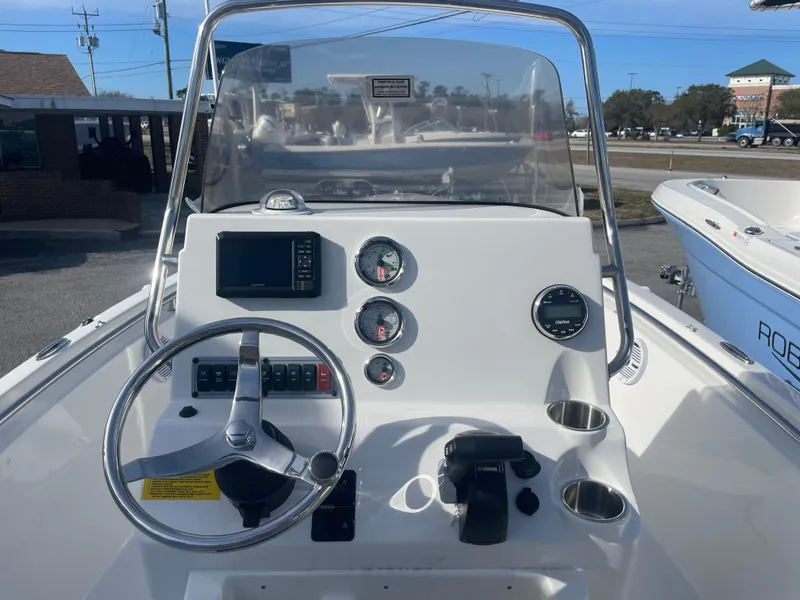 Slide: The Image of 2024 Key West 189 FS boat console with steering wheel and gauges. - 8