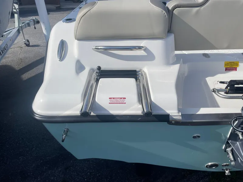 Slide: The Image of 2024 Key West 189 FS boat stern with swim ladder and seating. - 2