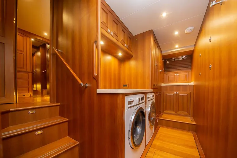 Slide: The Image of Luxurious wooden interior of 2026 Selene 60 Classic Explorer yacht with laundry appliances. - 12