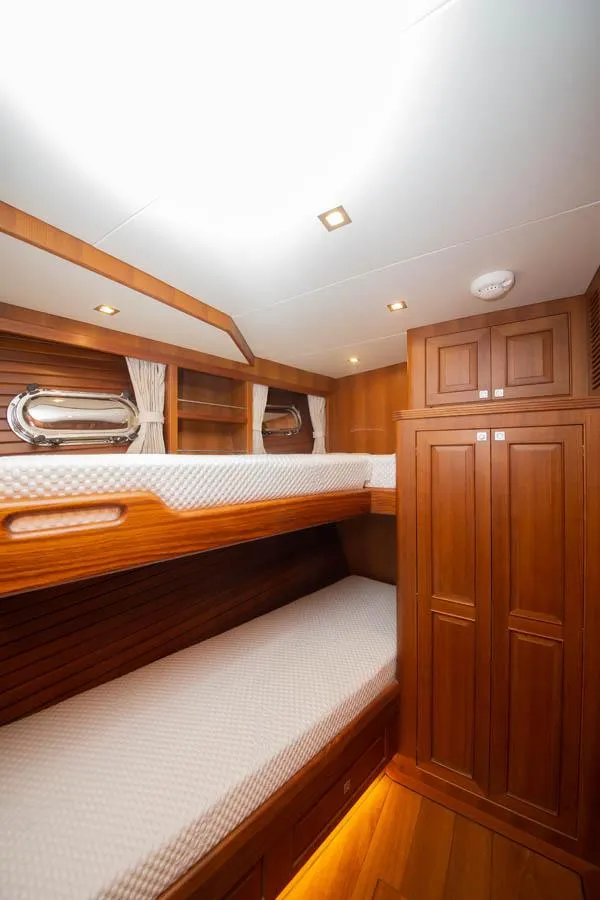 Slide: The Image of Interior of 2026 Selene 60 Classic Explorer yacht with wooden bunk beds. - 15