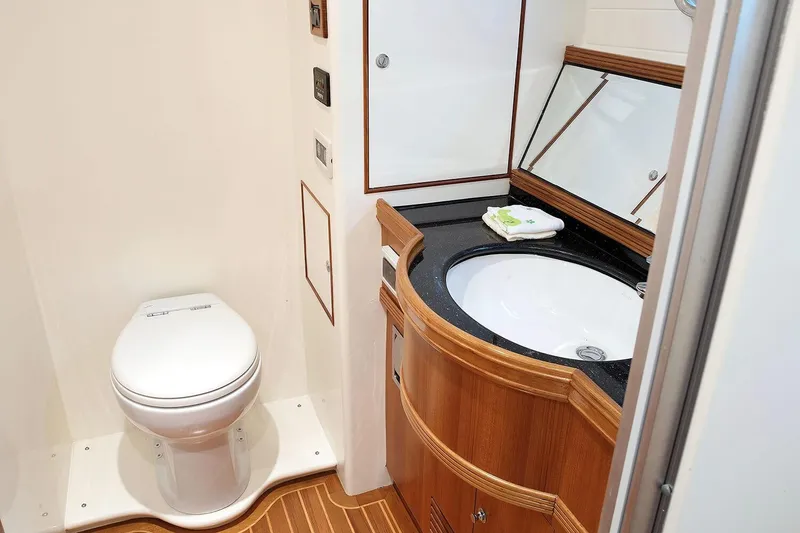 Slide: The Image of Bathroom interior of 2026 Selene 60 Classic Explorer yacht, featuring modern fixtures and wooden cabinetry. - 17