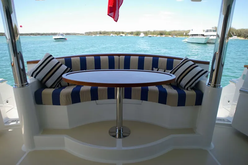 Slide: The Image of Luxury seating area on Selene 60 Classic Explorer yacht, 2026, with striped cushions and ocean view. - 19