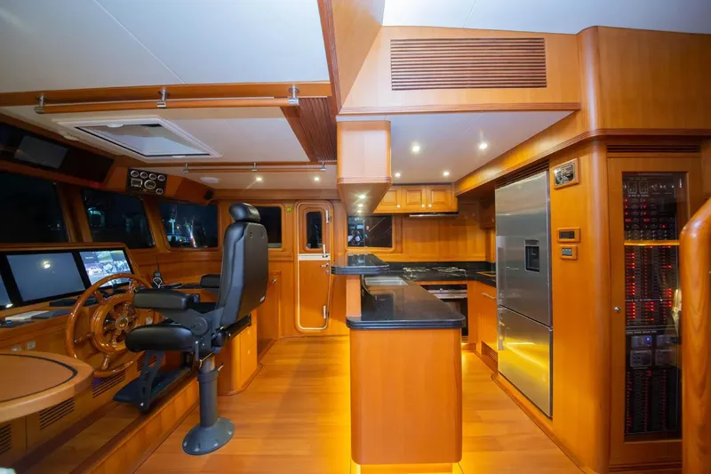 Slide: The Image of Luxurious interior of 2026 Selene 60 Classic Explorer yacht with modern kitchen and helm station. - 8
