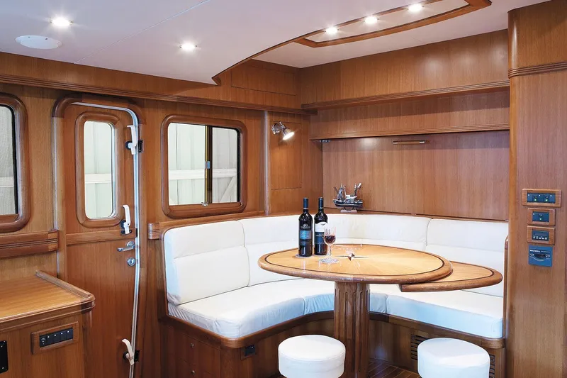 Slide: The Image of Luxurious interior of 2026 Selene 60 Classic Explorer yacht with elegant dining area. - 9