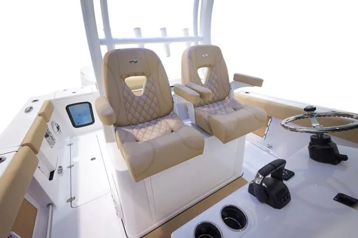 Slide: The Image of 2024 Sportsman Open 322 boat interior with dual captain's chairs and steering console. - 7