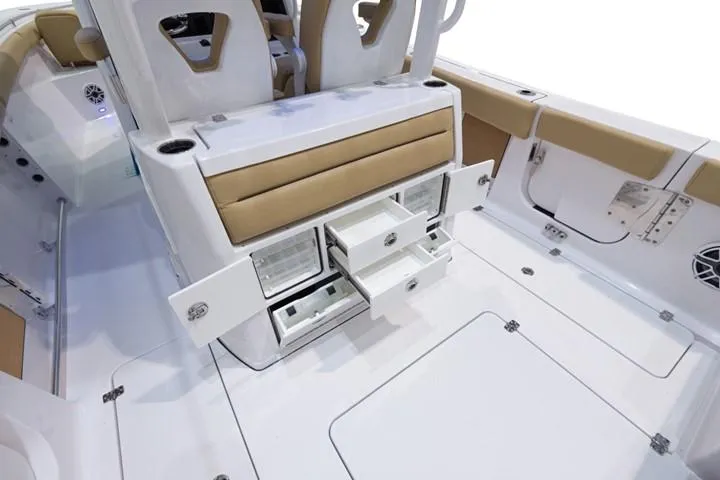 Slide: The Image of 2024 Sportsman Open 322 boat interior with storage compartments and seating. - 8