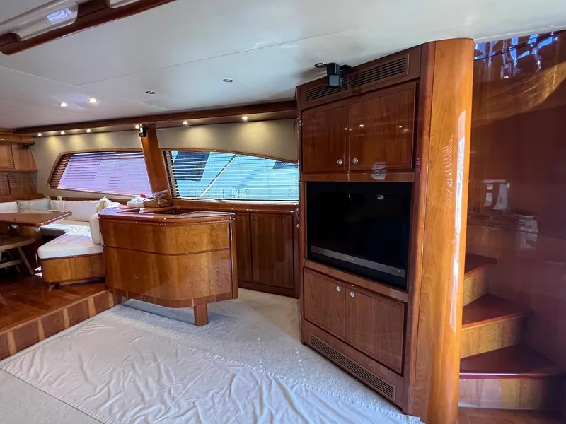 Slide: The Image of Luxurious interior of a 2004 Bertram 670 yacht with wooden cabinetry and modern amenities. - 25