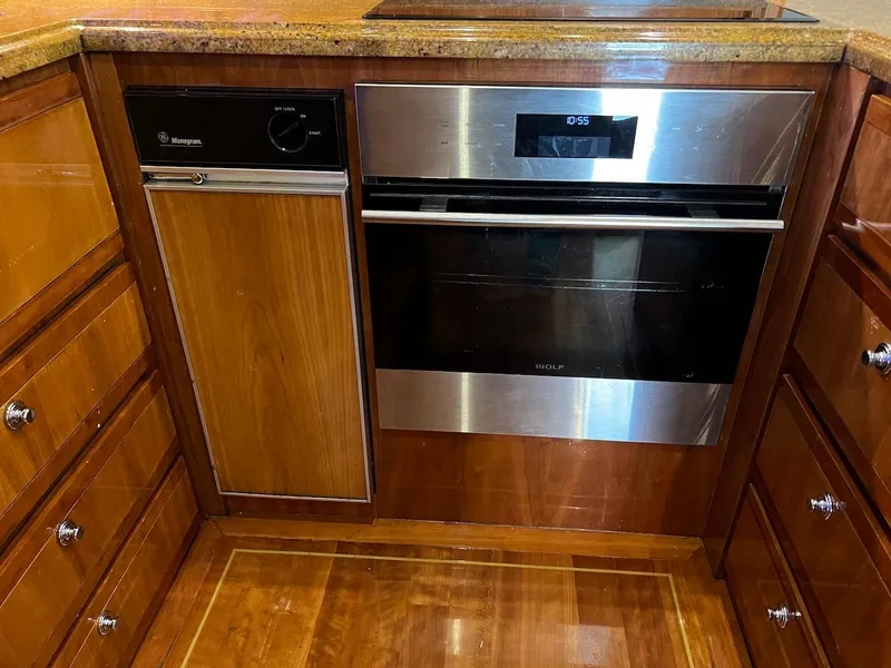 Slide: The Image of Modern kitchen in a 2004 Bertram 670 yacht with stainless steel appliances. - 32