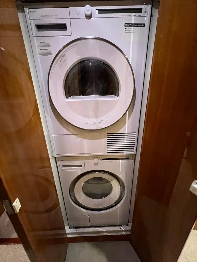 Slide: The Image of Stacked washer and dryer in a 2004 Bertram 670 yacht. - 45