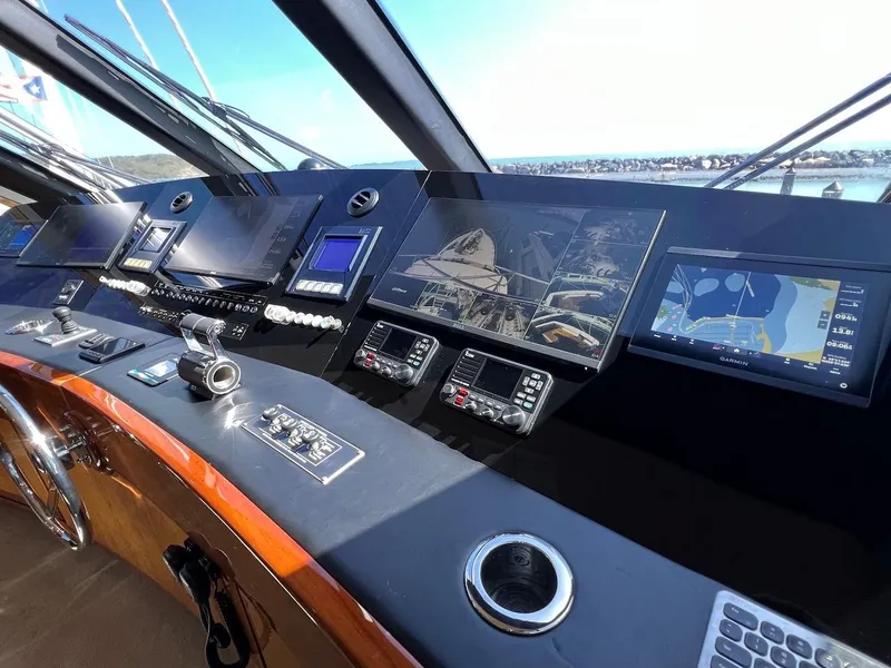 Slide: The Image of Control panel of a 2004 Bertram 670 yacht with advanced navigation systems. - 49