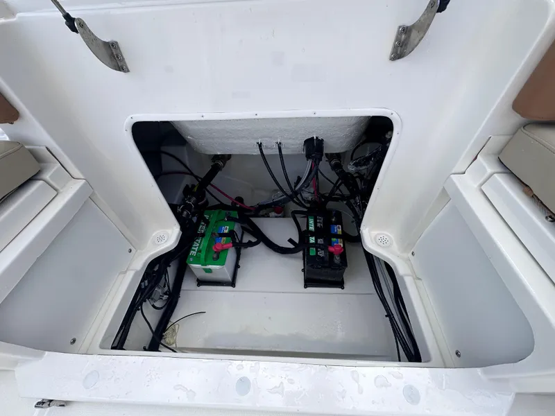 Slide: The Image of Battery compartment of 2024 NauticStar 222L Offshore boat. - 12