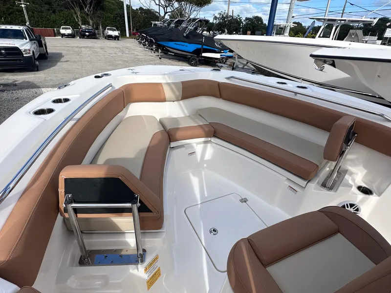 Slide: The Image of 2024 NauticStar 222L Offshore boat with spacious seating and modern design. - 3