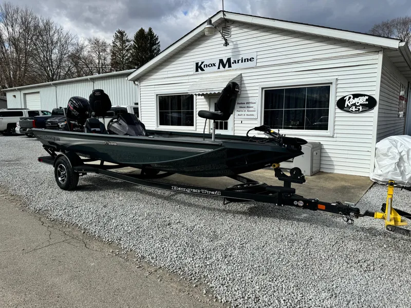 Slide: The Image of 2024 Ranger RT188 boat on trailer outside Knox Marine dealership. - 1