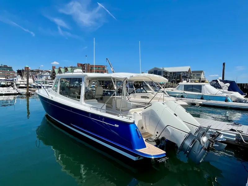 Slide: The Image of 2024 MJM 35 boat docked at a marina on a sunny day. - 3