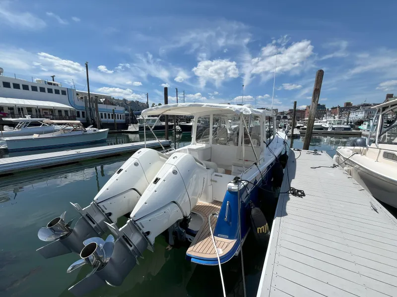 Slide: The Image of 2024 MJM 35 boat docked at a marina on a sunny day. - 4