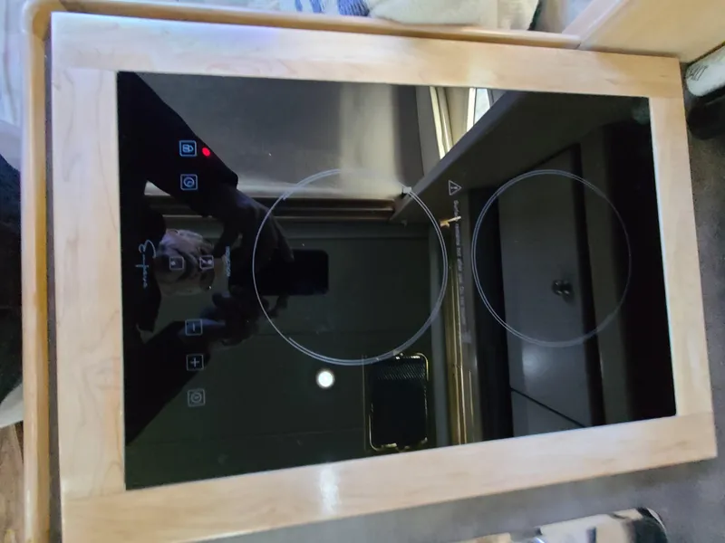 Slide: The Image of 1995 Bayliner Avanti electric stove with two burners and touch controls. - 18