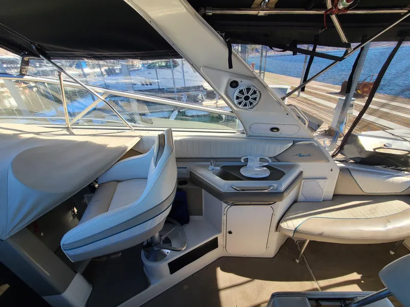 Slide: The Image of 1995 Bayliner Avanti boat interior with seating and helm station. - 8