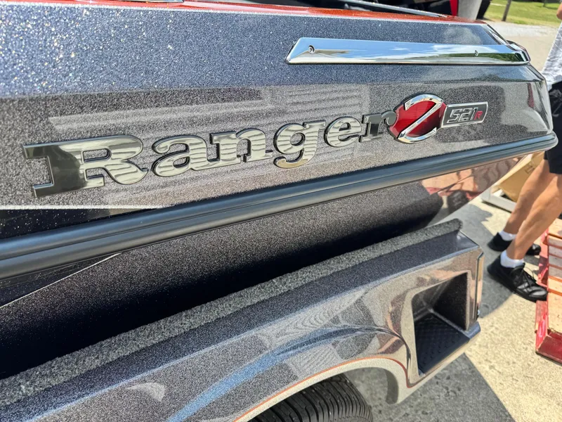 Slide: The Image of 2024 Ranger Z521R CUP boat, close-up of logo and sleek design. - 10
