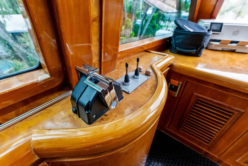 Slide: The Image of Luxurious wooden helm of 1999 Monte Fino 82 yacht with control panel. - 13