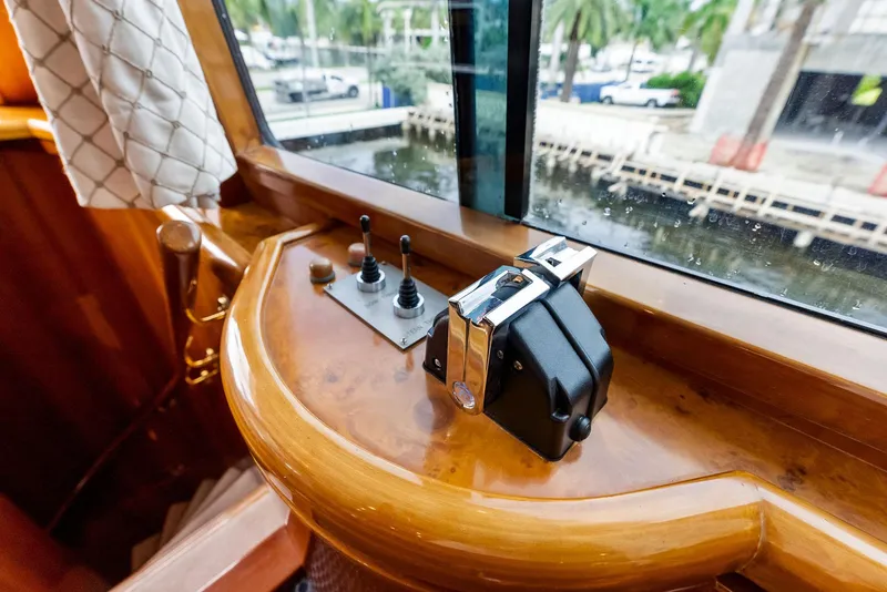 Slide: The Image of Monte Fino 82 yacht helm controls, 1999 model, with waterfront view. - 14