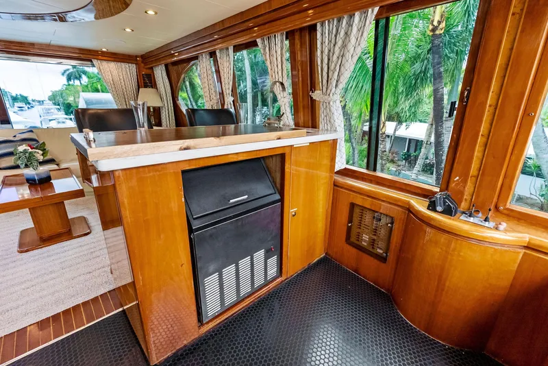 Slide: The Image of Luxurious interior of 1999 Monte Fino 82 yacht with wood paneling and large windows. - 16